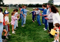 waterballoon toss between adults and children for Sports Day activities C.June 1987