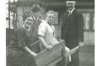 William and Jeannie Struthers posed with friends, Dr. and McCallum, on the south side of the General Store building. It is noted the living room windows are different from those in place today. 1924c.