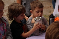 Two boys making butter during our Heritage Thursday 2018 session