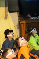 Children watching a 3-D movie