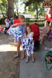 Children showing their tie-dye shirts