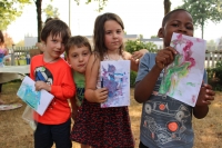 Children showing off their marbled paper