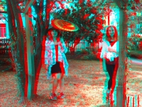 Two little girls posing outside for their 3-D photograph