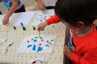 A child preparing his foam for his paper marbling