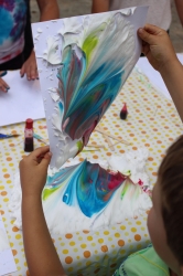 A child marbling his paper