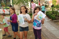 Children showing off their marbled paper