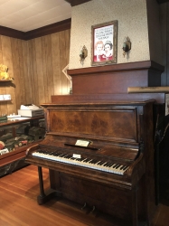 Photo of the piano in the parlour before